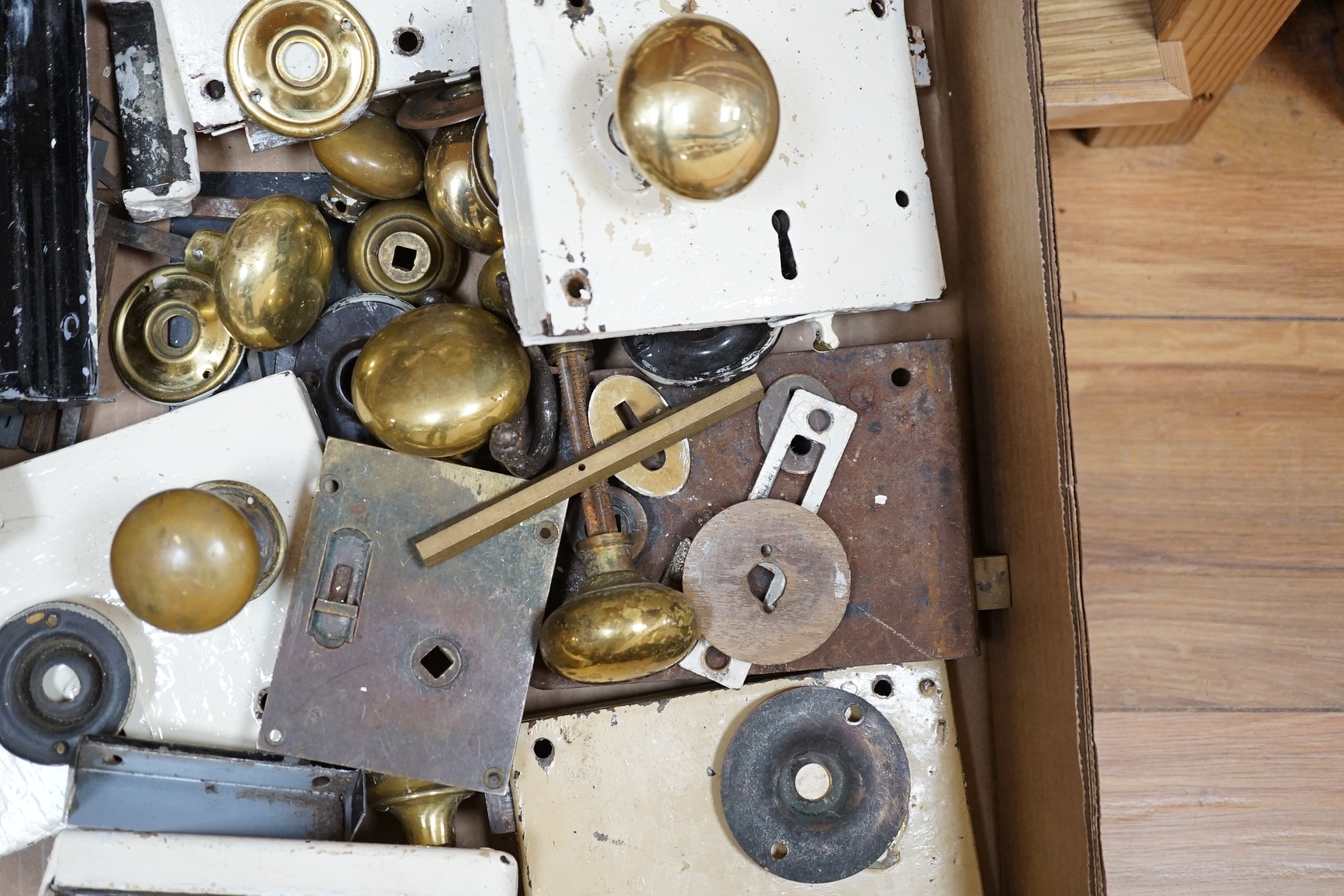 A collection of door locks and brass knobs